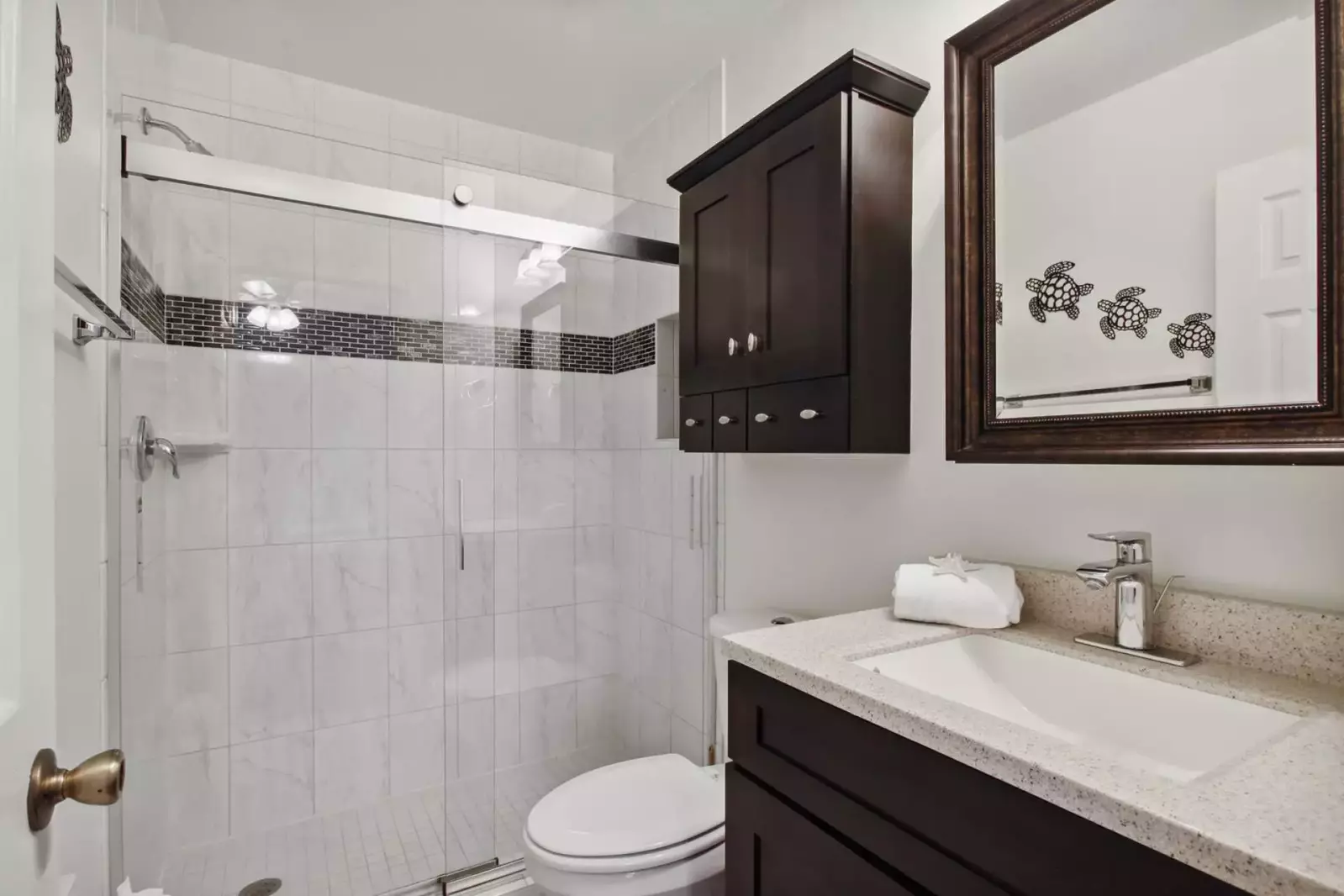 Updated tiled walk-in shower in guest en suite bath