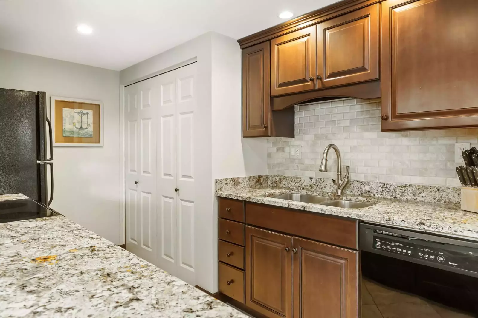 The full size washer and dryer tucked behind doors