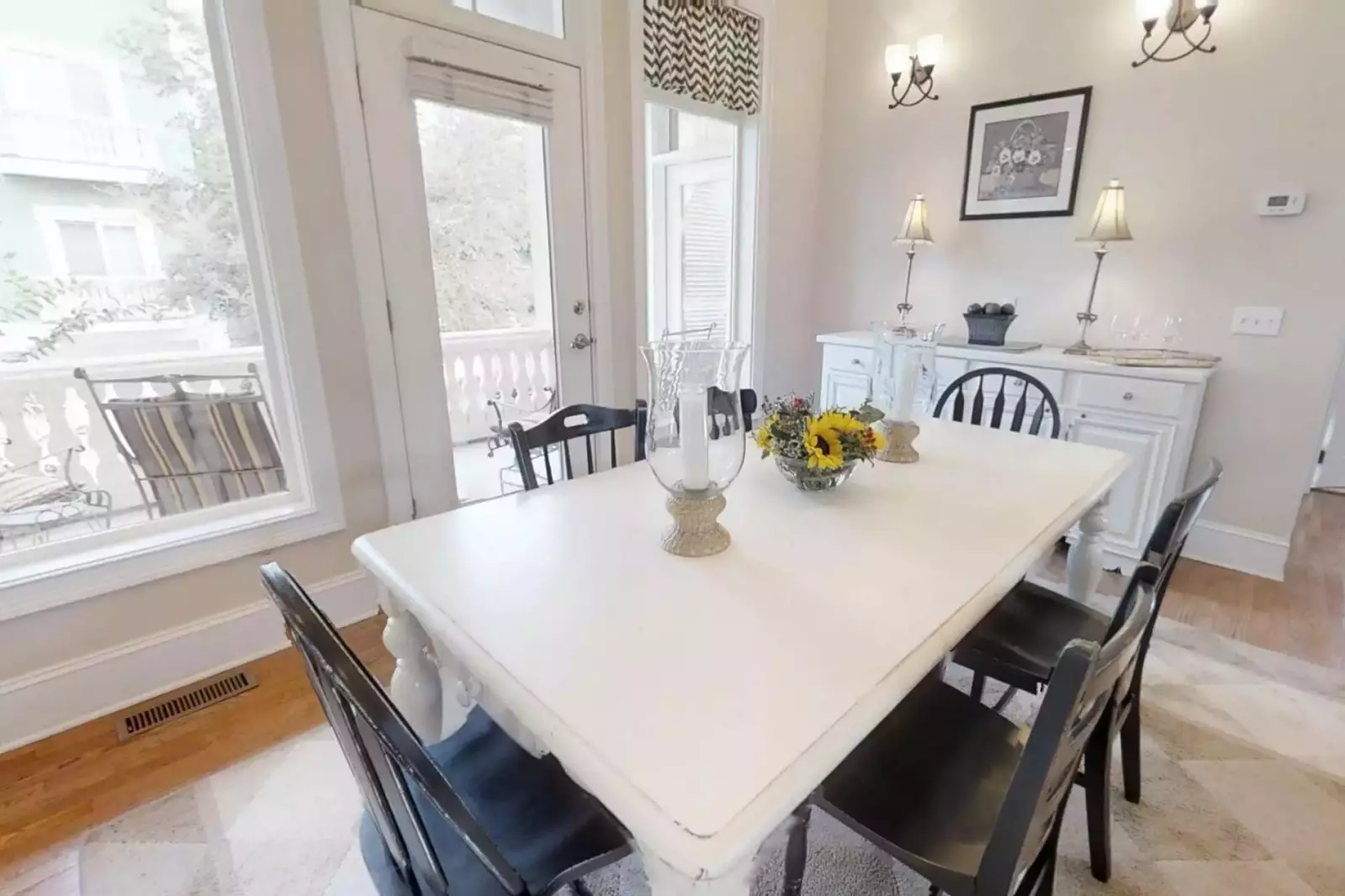 The second floor outdoor balcony has seating for four and is ideal for enjoying your morning coffee or an evening beverage