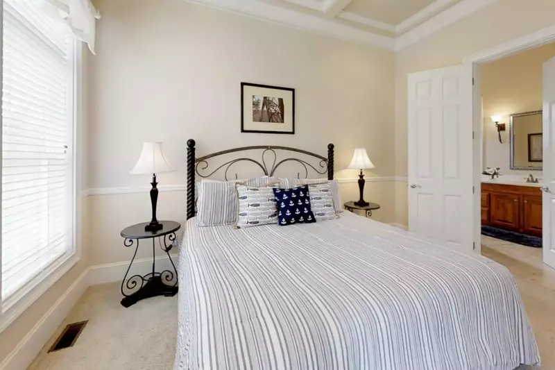 Guest bedroom #2 with a king size bed & en suite bath located on the second level