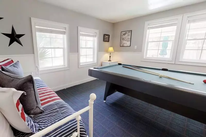The game room looks over the pool area