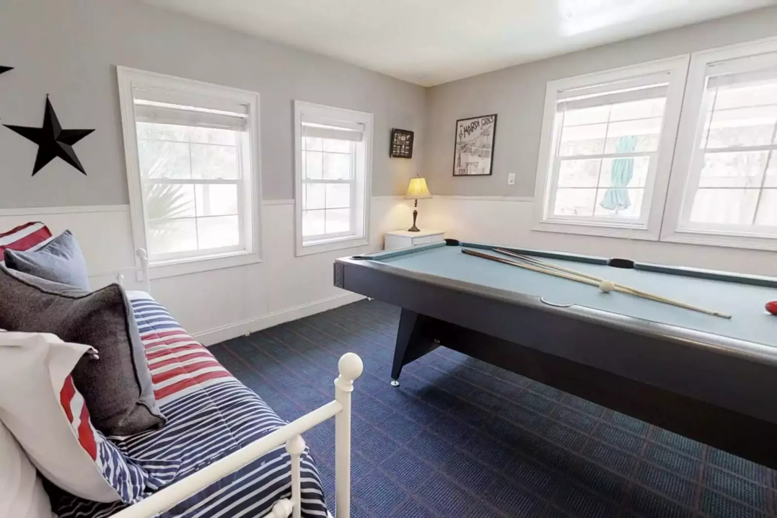 The game room looks over the pool area
