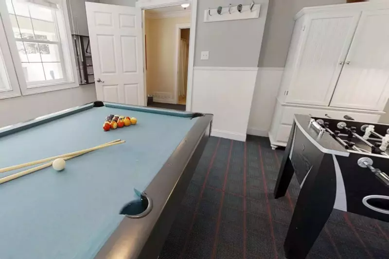 A guest bathroom is conveniently located on the ground level located close to the pool and game room