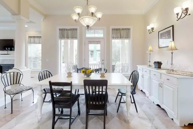 The large wooden table seats 8