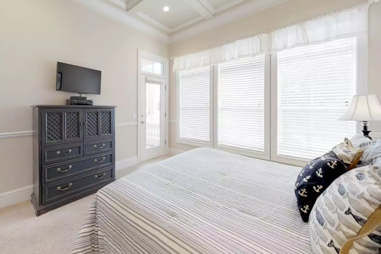 Second level guest bedroom (#2) with access to outdoor balcony