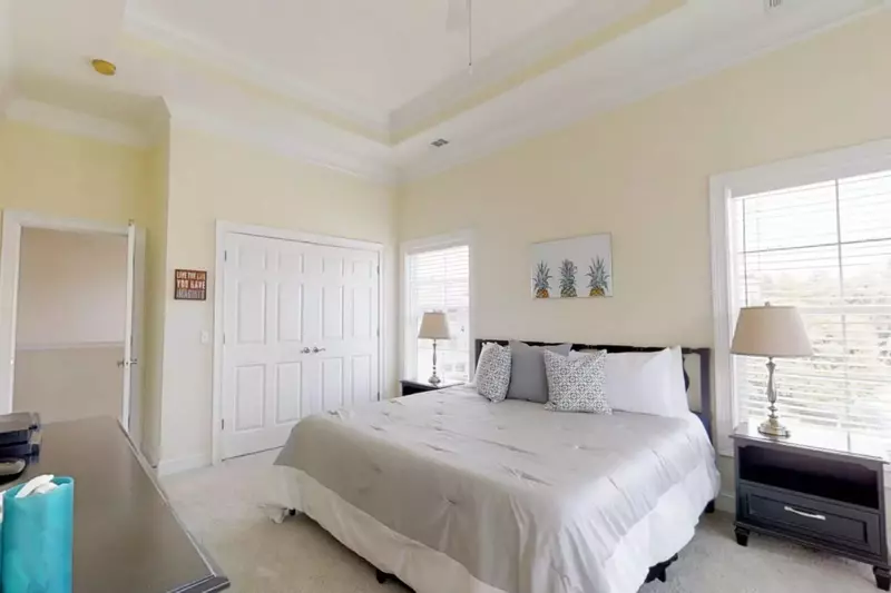 Guest bedroom #3 has large closet, ceiling fan and dresser