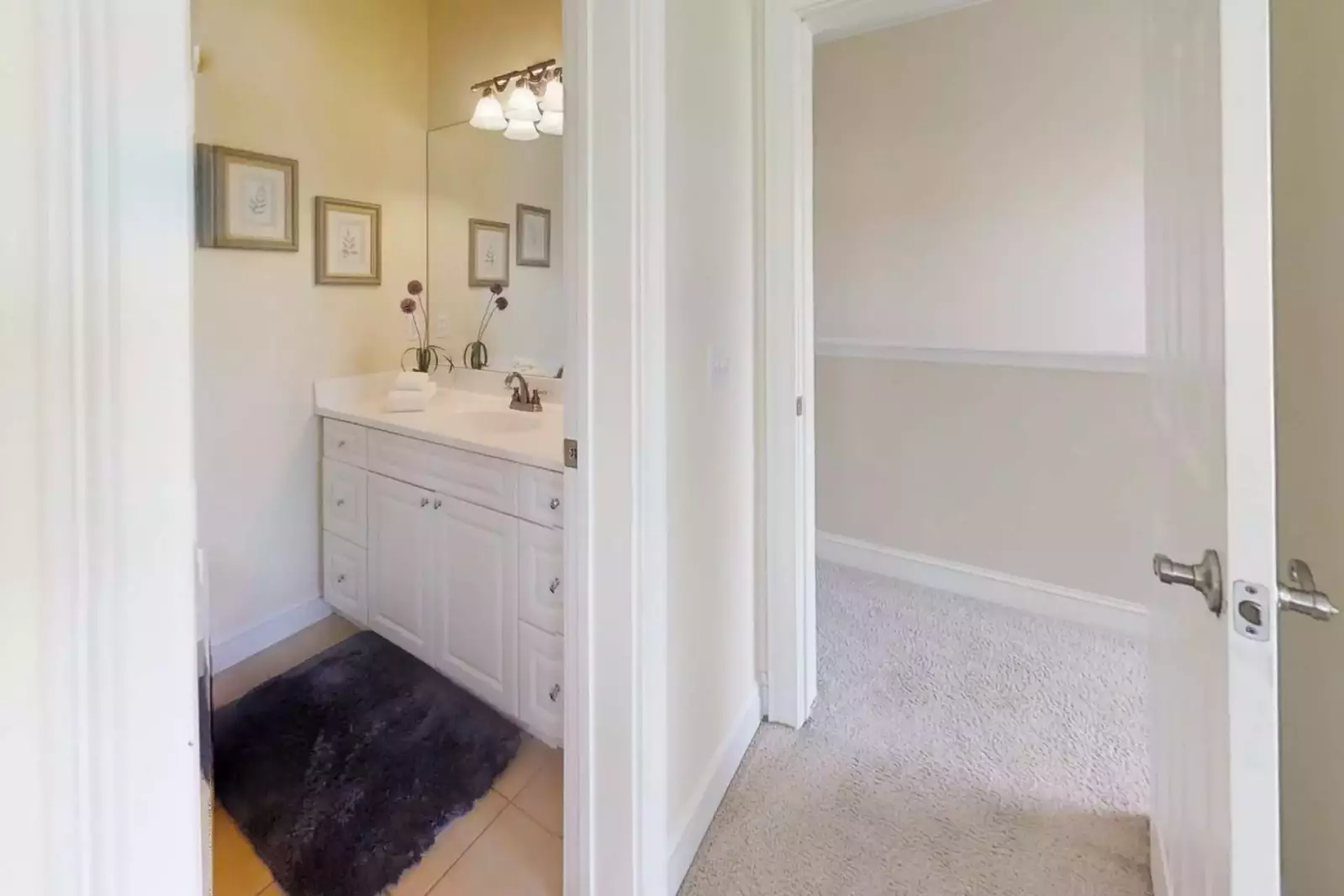 The en suite bath for guest bedroom #3 has a shower/tub combination