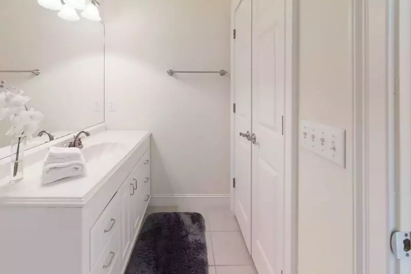 En suite bathroom for guest bedroom #4-complete with large closet and shower/tub combination