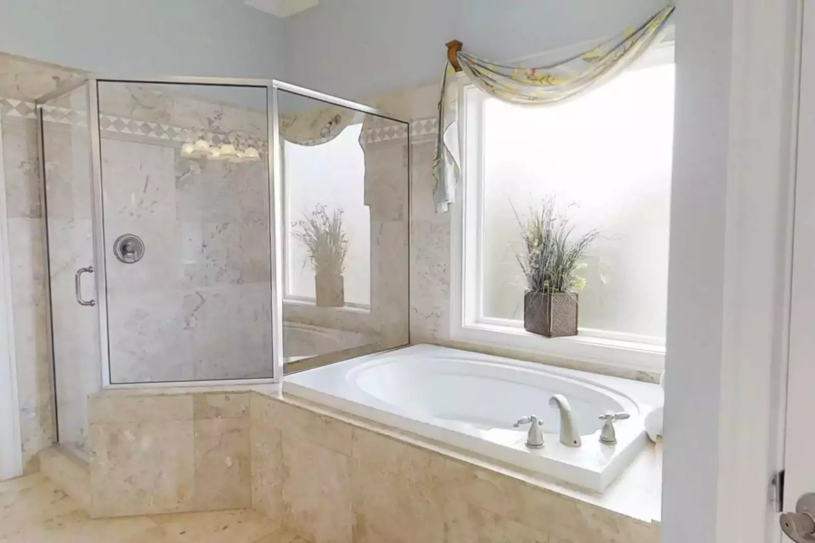 The Master en suite bathroom has large walk-in shower and jetted tub