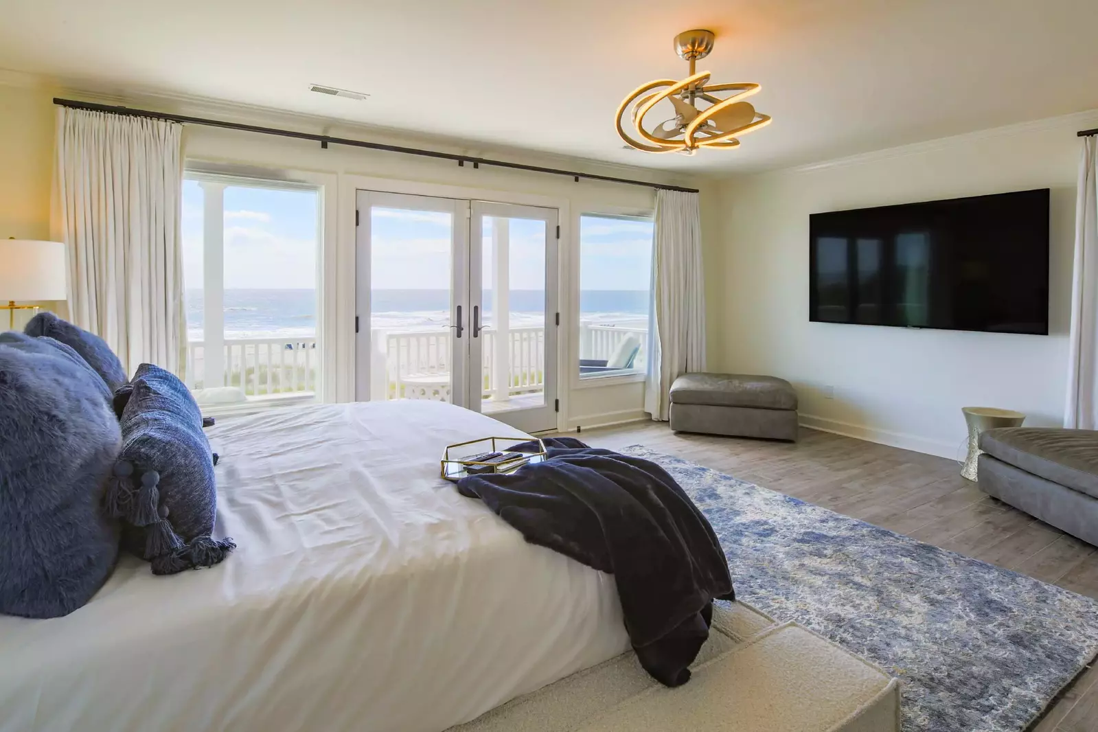 The primary suite has nearly wall-to-wall ocean views and a covered balcony to take in the salty sea breezes.