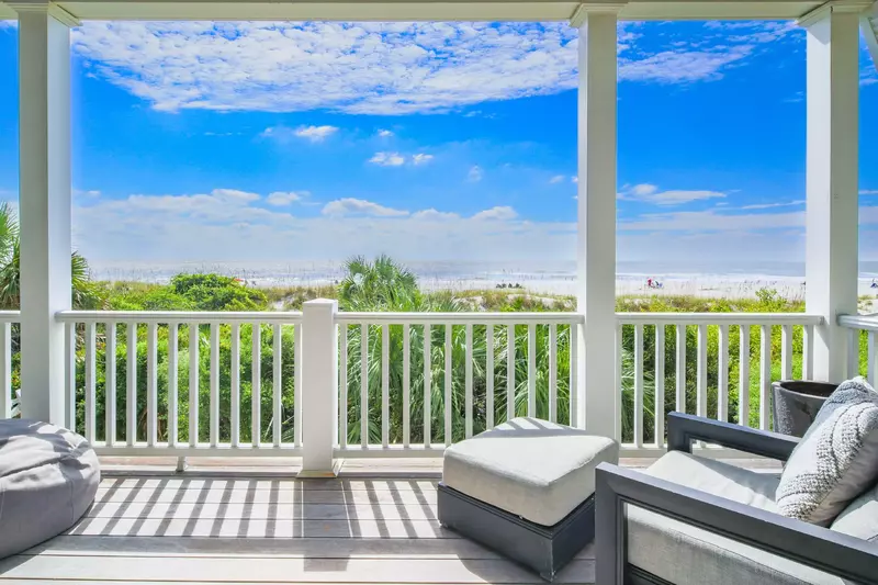 Step out onto the covered balcony to enjoy this fabulous view.