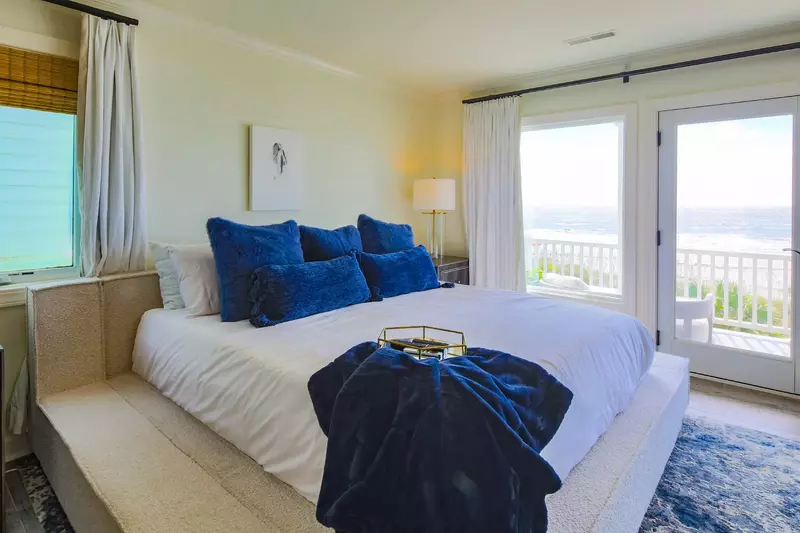 The primary suite also has access to a private balcony with ocean views.