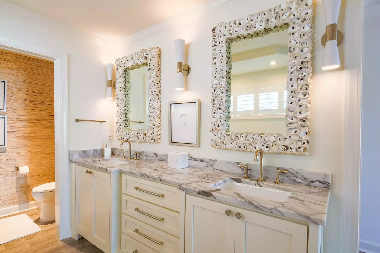 The bathroom for the primary suite features a dual sink vanity.