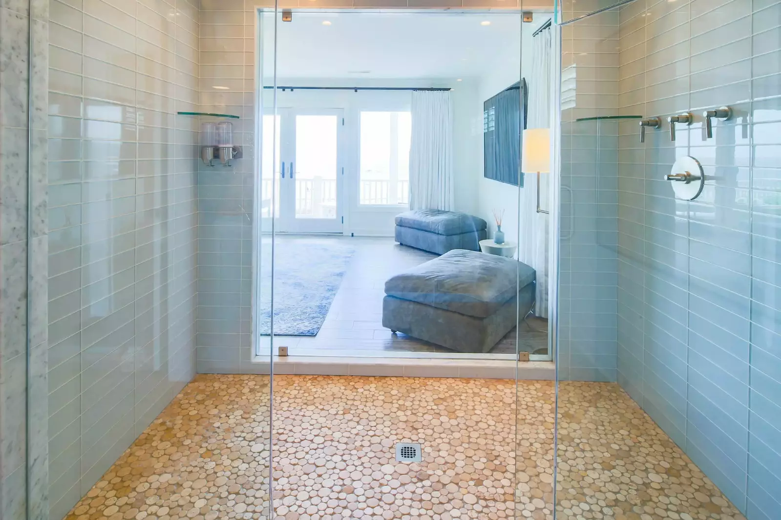 Enjoy ocean views from the tiled, walk-in primary suite shower!
