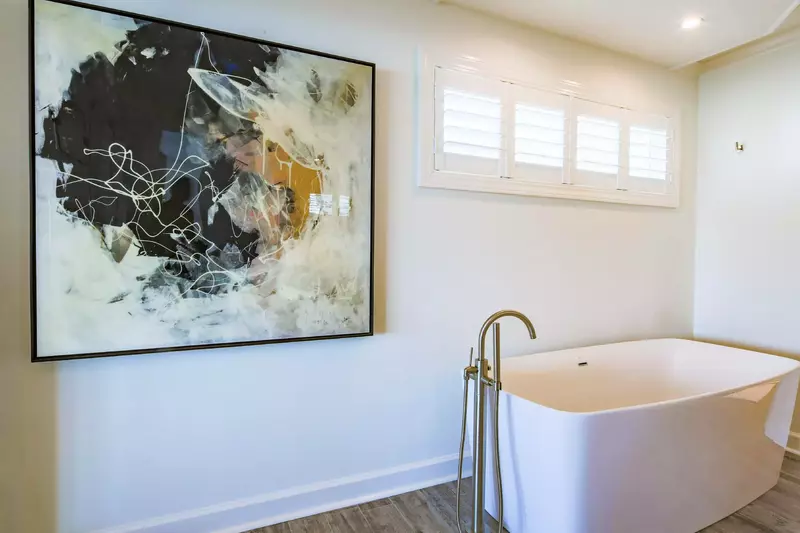 The en suite bathroom also has a soaking tub.