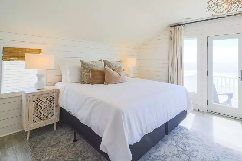 The king suite has two night stands and reading lamps.