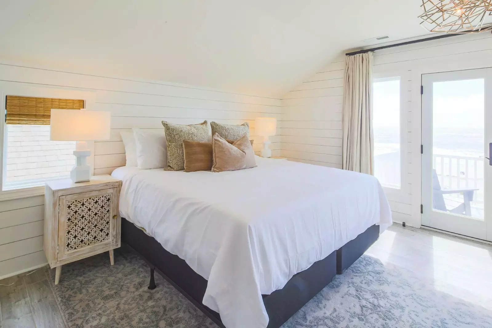 The king suite has two night stands and reading lamps.