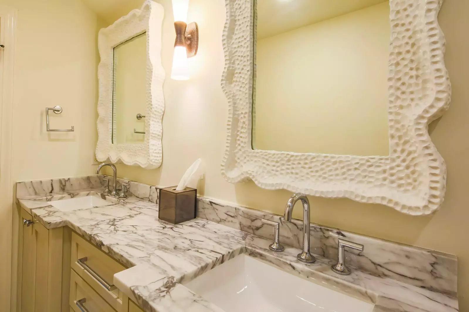 The en suite bathroom features a dual sink vanity.