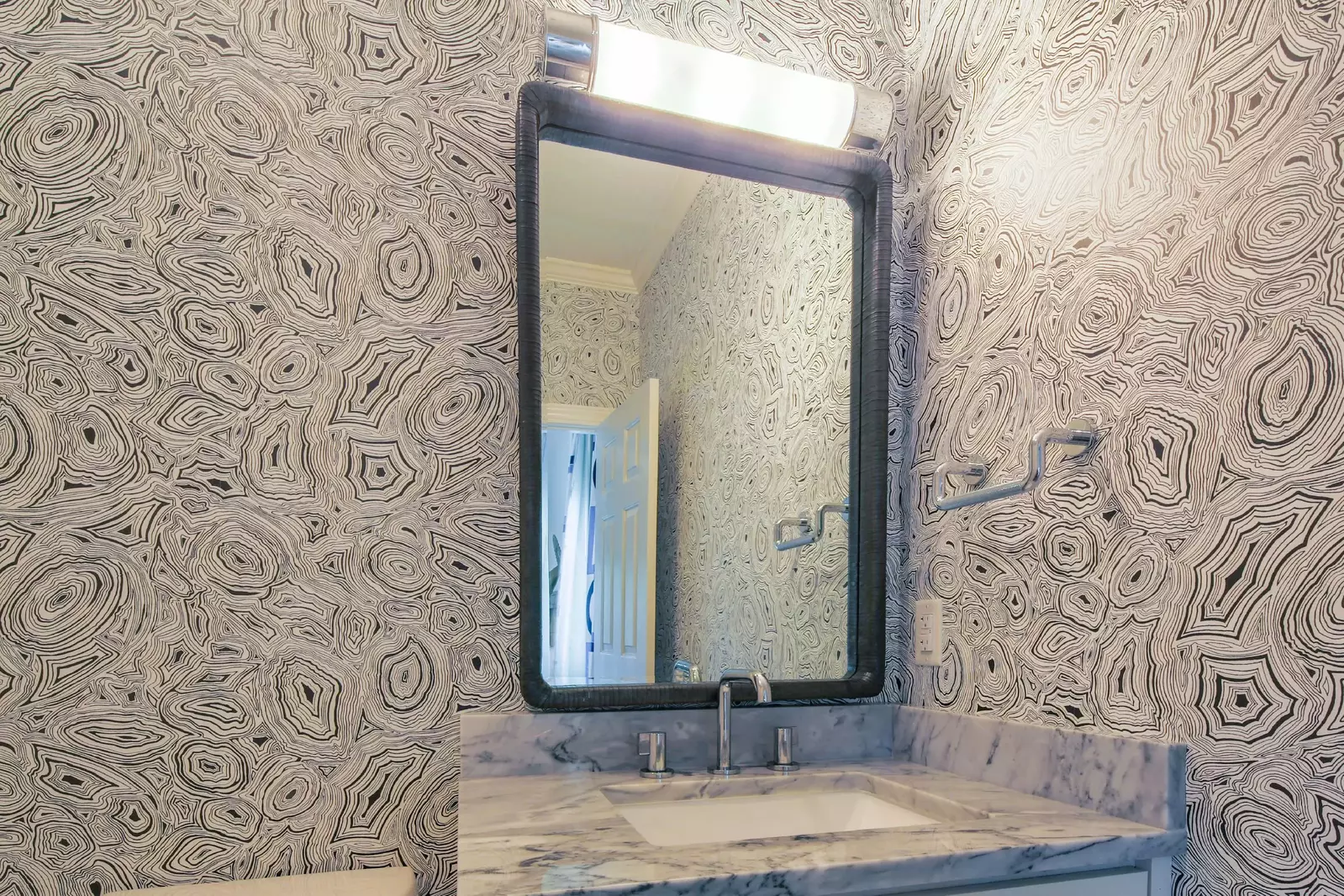 The en suite bathroom features a spacious vanity.