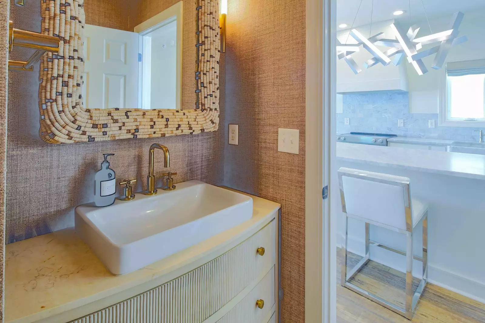 The half bathroom is located on the lower level near the kitchen.