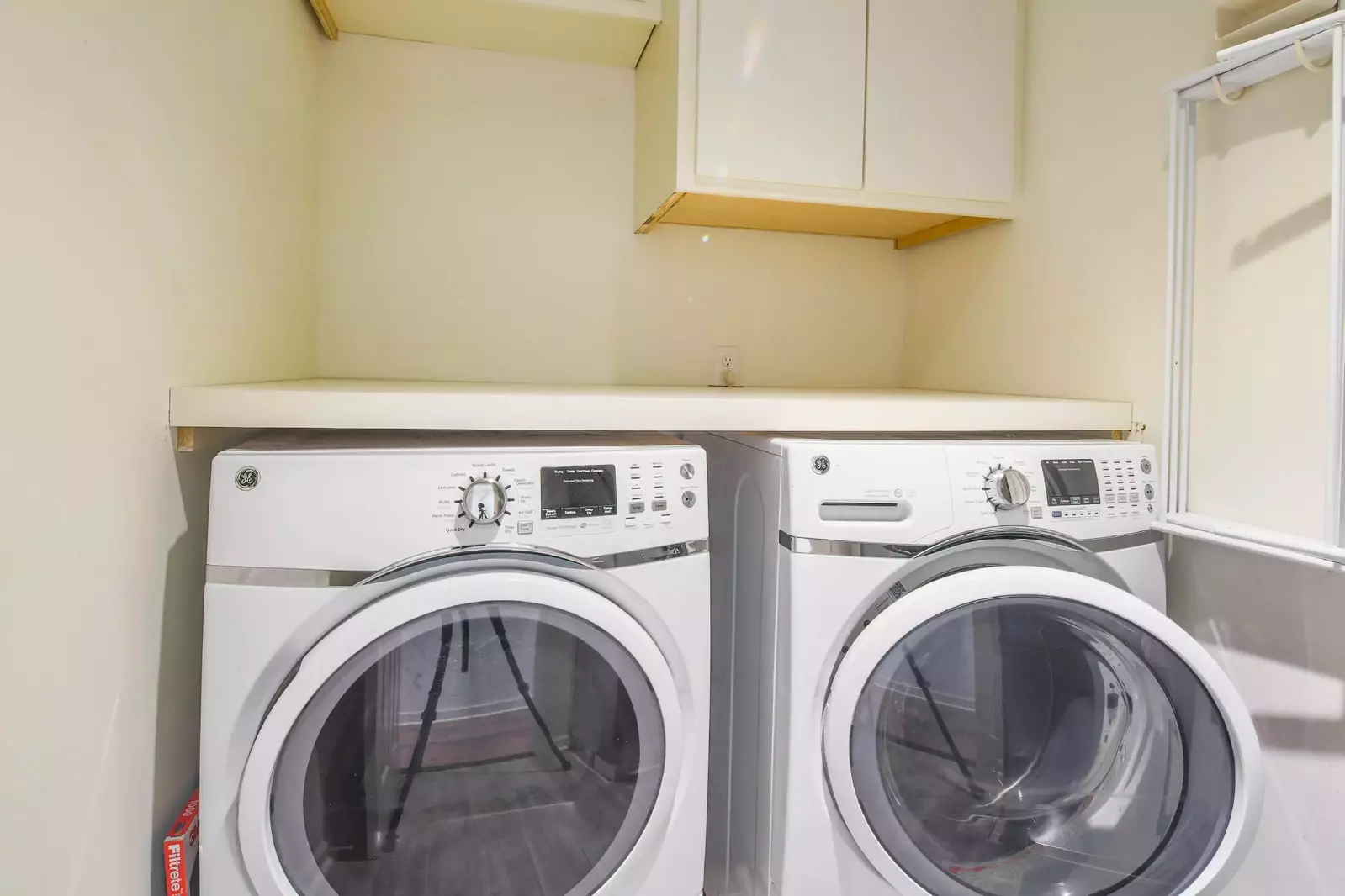 There is a washing machine and dryer in the home.