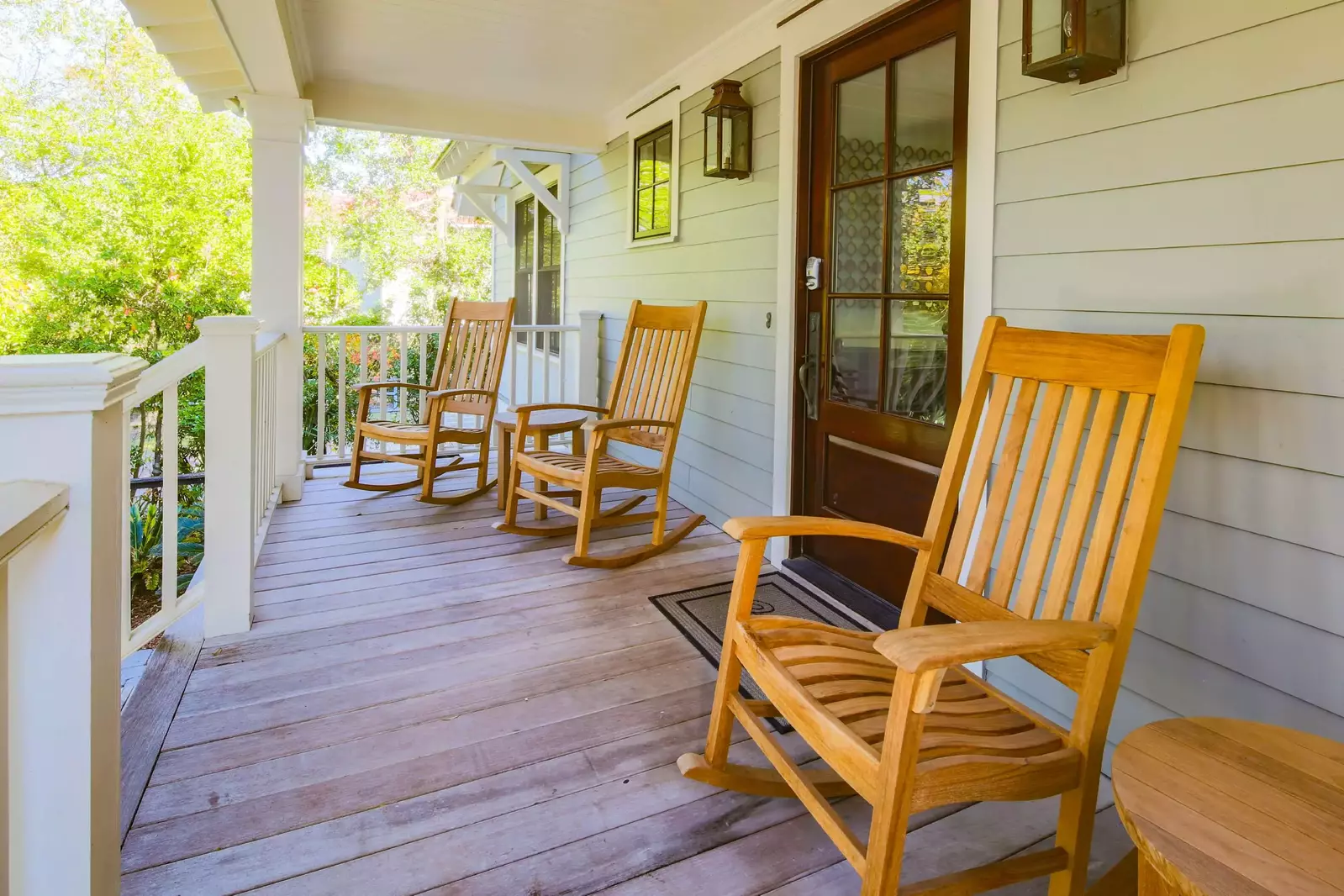 These teak rocking chairs welcome you as you arrive to the front door.