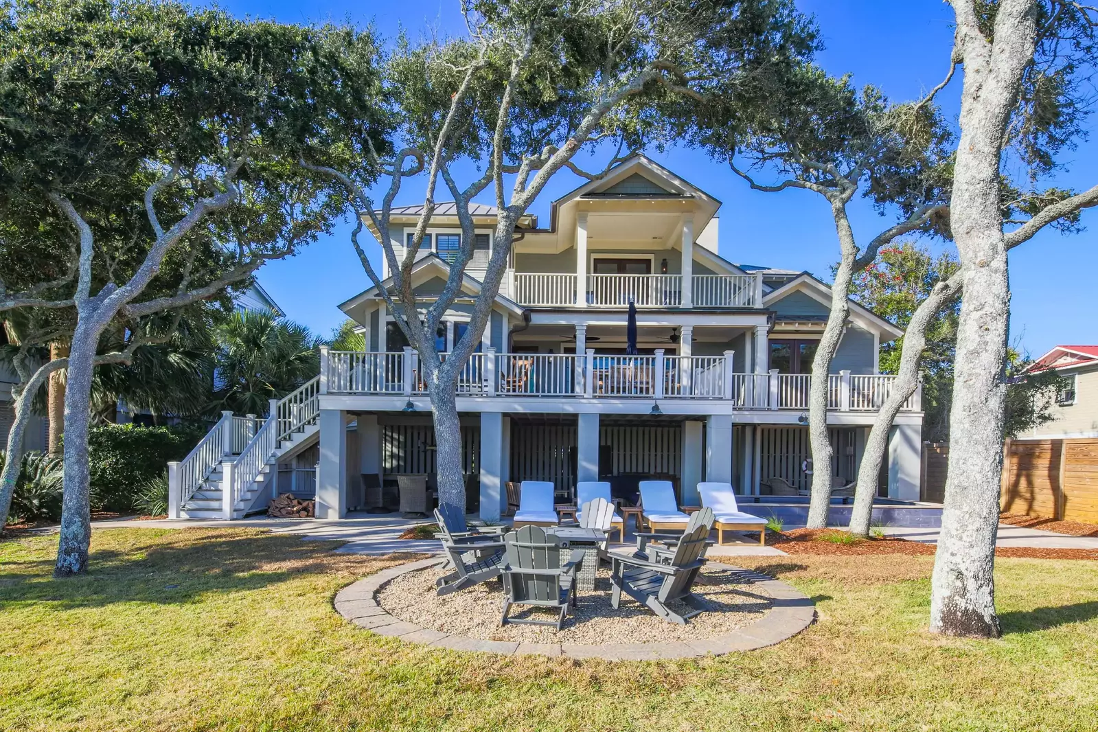 The oceanside of the home features three separate levels of patio, decks and balconies.