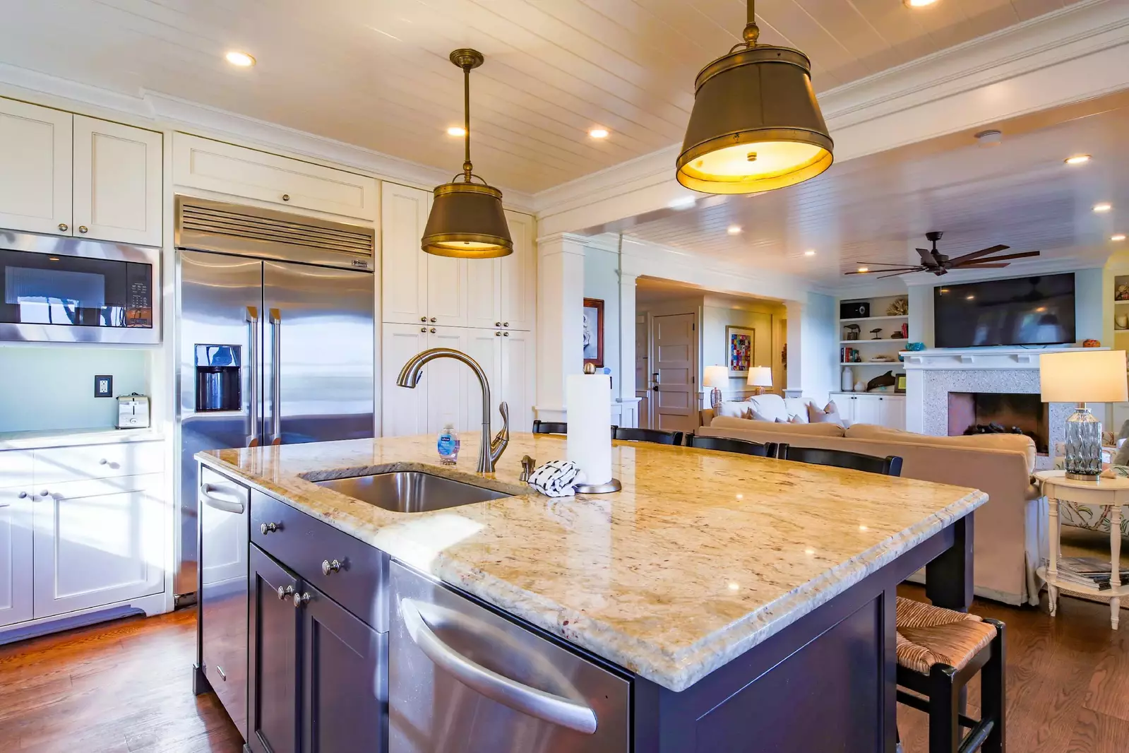 There is an open layout between the living room and the kitchen.