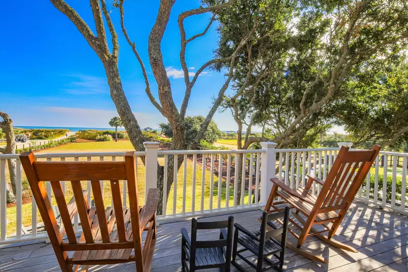 This covered porch is accessible from the second floor master suite and den.