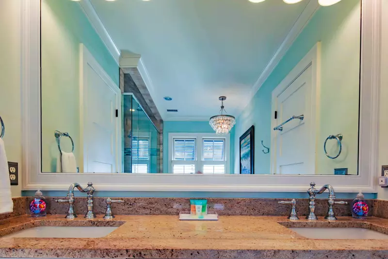 The master bathroom features a spacious, double sink vanity.