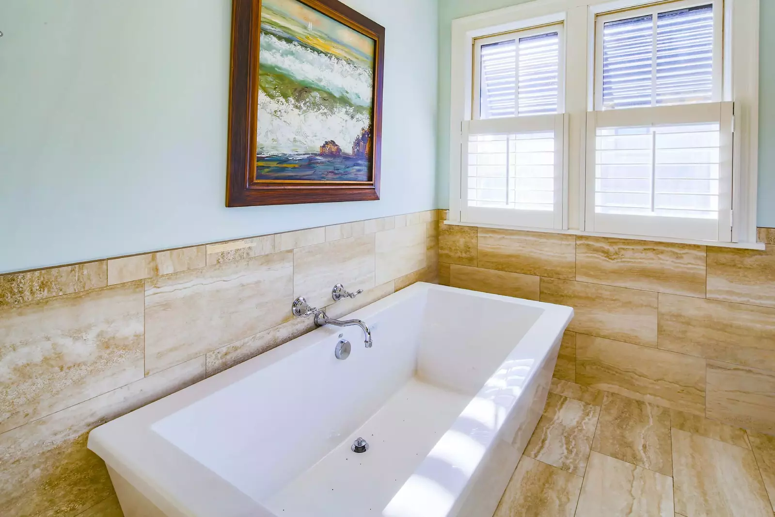 The master suite has beautifully tiled walls & floor as well as a stand alone soaking tub.