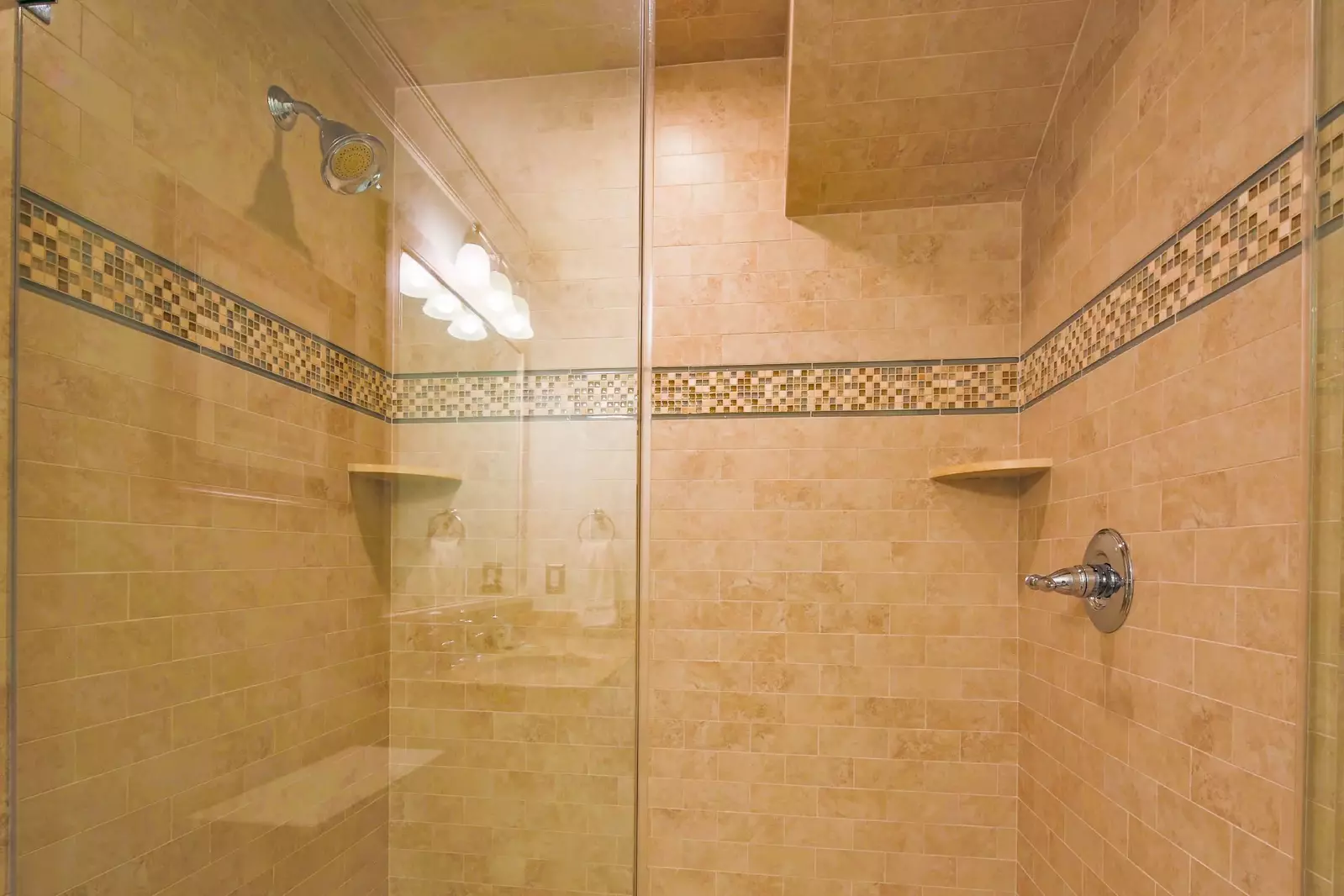 The en suite bathroom also features this tiled, walk-in shower.