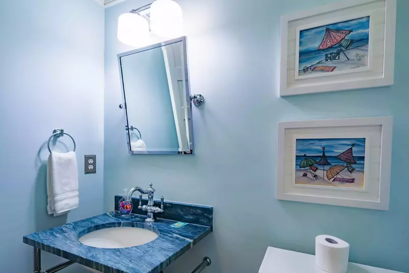 There is a half bathroom on the lover level near the front door.