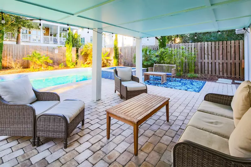 There is also a partially covered patio, which is perfect for cooling off or keeping an eye on the kids in the pool.