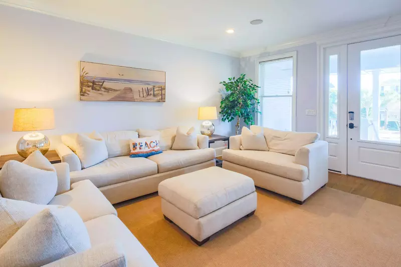 When you enter the home's front door, you'll find this comfortable den with spacious seating.