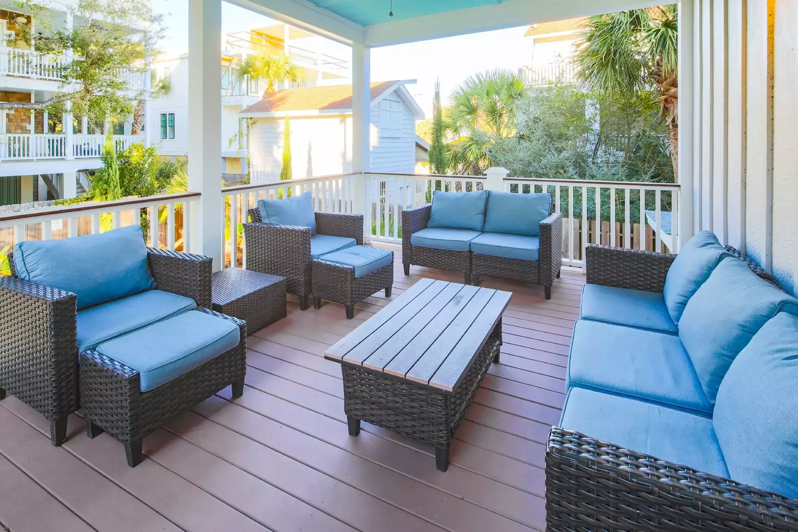 This back deck is located off of the first floor den and it overlooks the backyard pool.