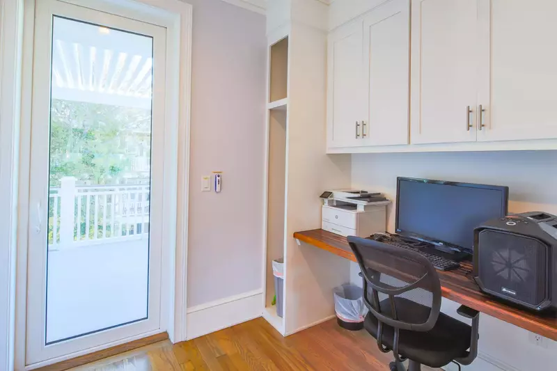 There is a desk & workspace near the kitchen.