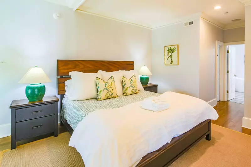 The master suite, which is located off of the living room on the second floor, features a king bed.