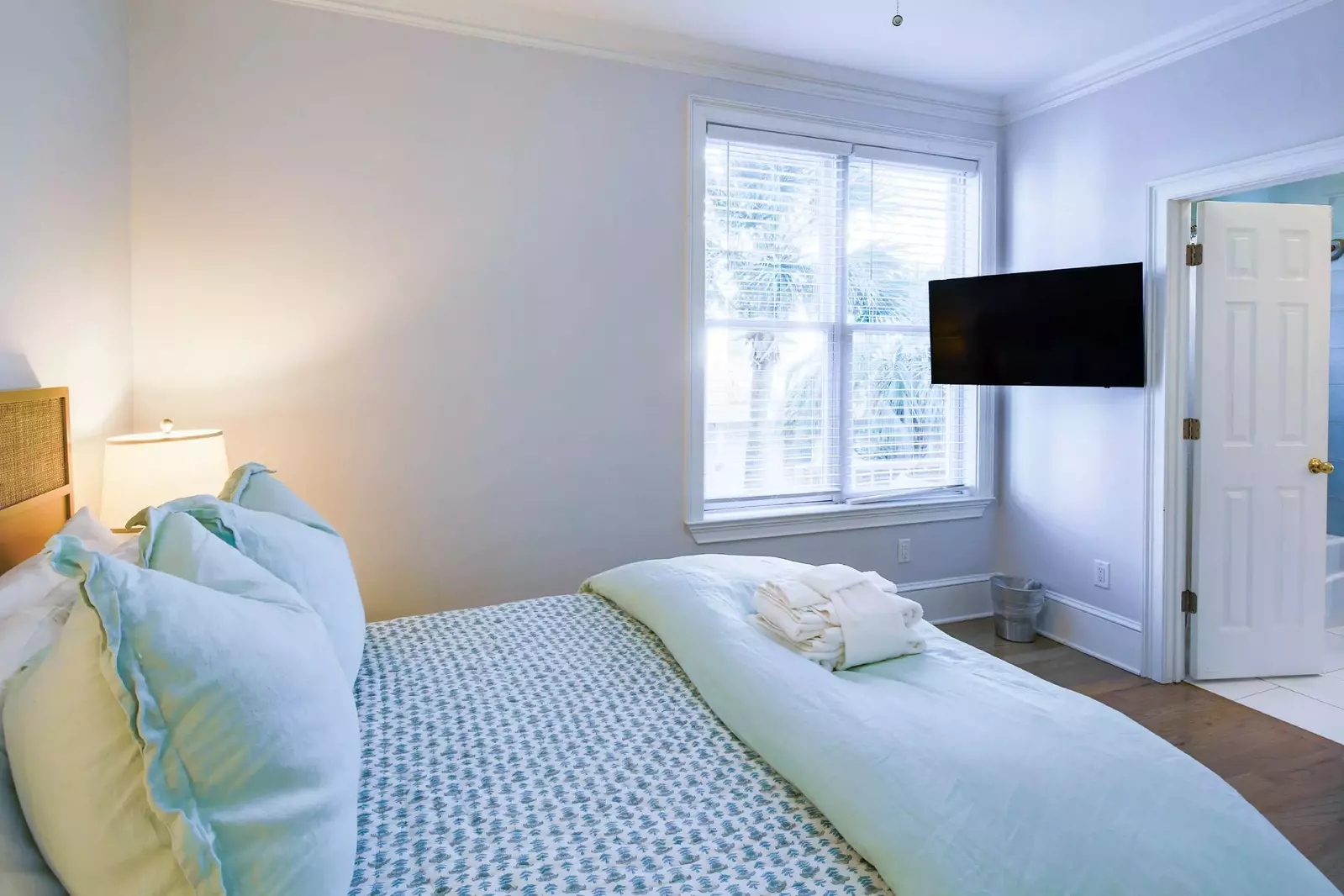 This bedroom also features a mounted smart TV and access to the shared Jack & Jill bathroom.