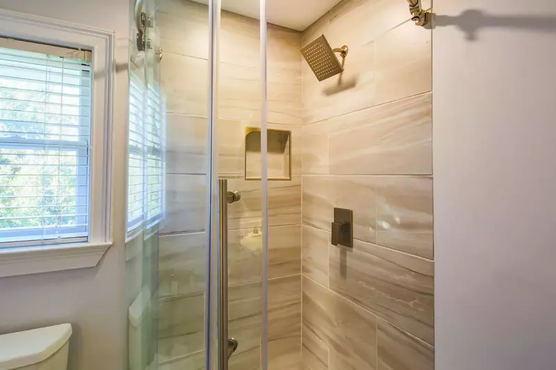The third floor bathroom also has a tiled, walk-in shower.