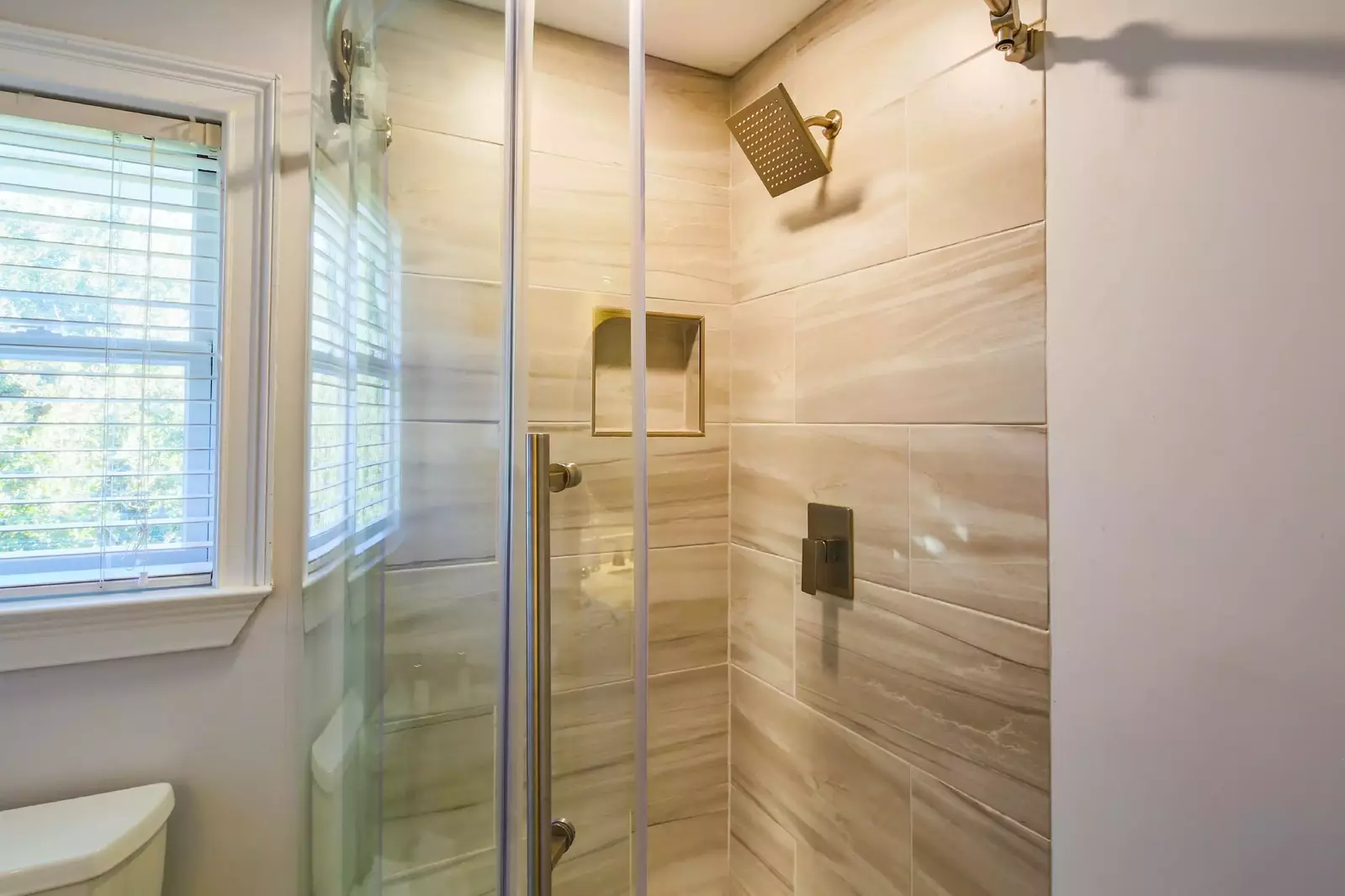 The third floor bathroom also has a tiled, walk-in shower.