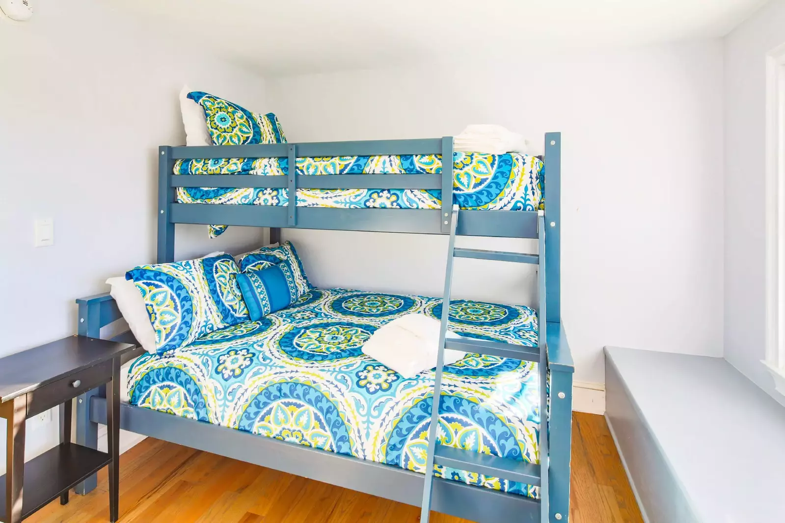 This bunk bedroom -- also with a full and twin beds -- is located on the other side of the game room.