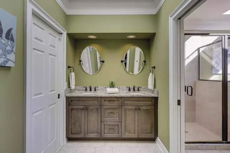 Double vanity in primary bedroom ensuite