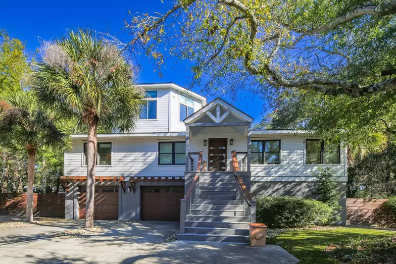 Take the staircase from the driveway to the front porch to access this incredible Isle of Palms vacation rental home.