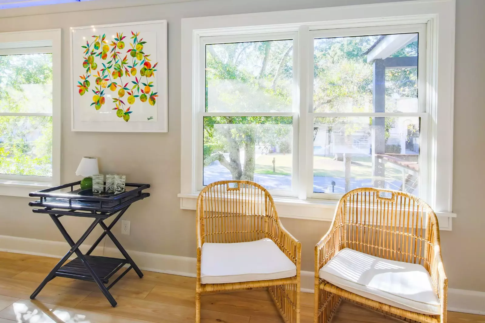This seating area, which receives lovely natural light, is located near the front door.