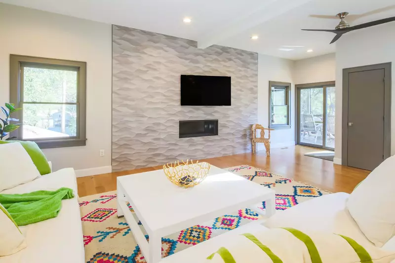 You may access the screened porch via the family room at the foot of the stairs to the three guest bedrooms.