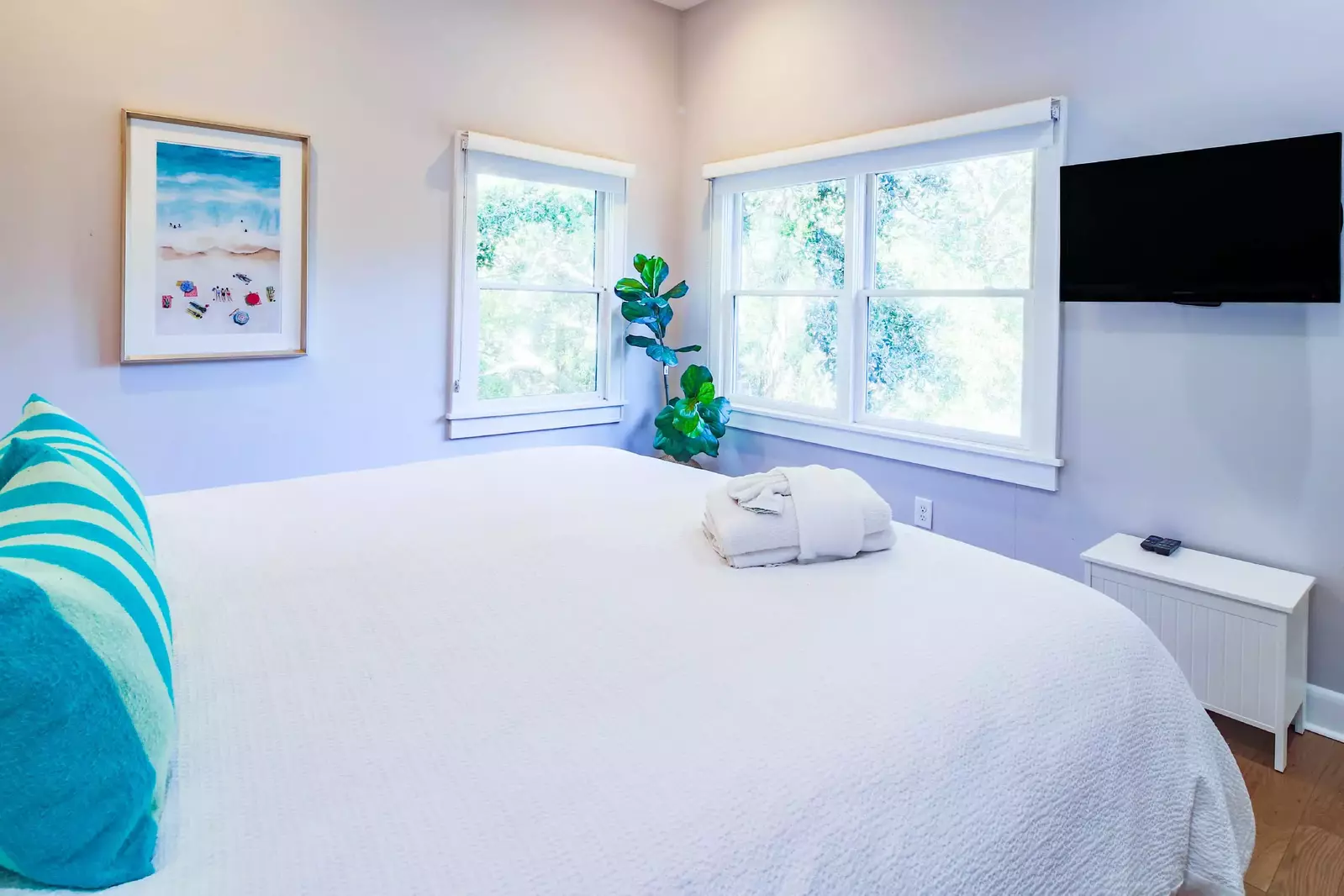 The king suite also has a wall-mounted TV.