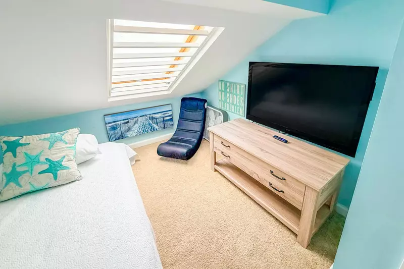 There is also a wall-mounted TV in the loft.