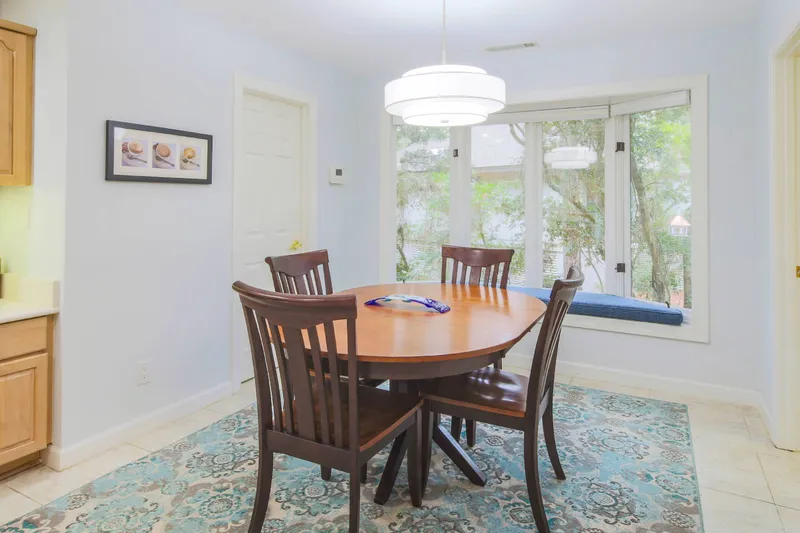 The kitchen dining table seats 4.