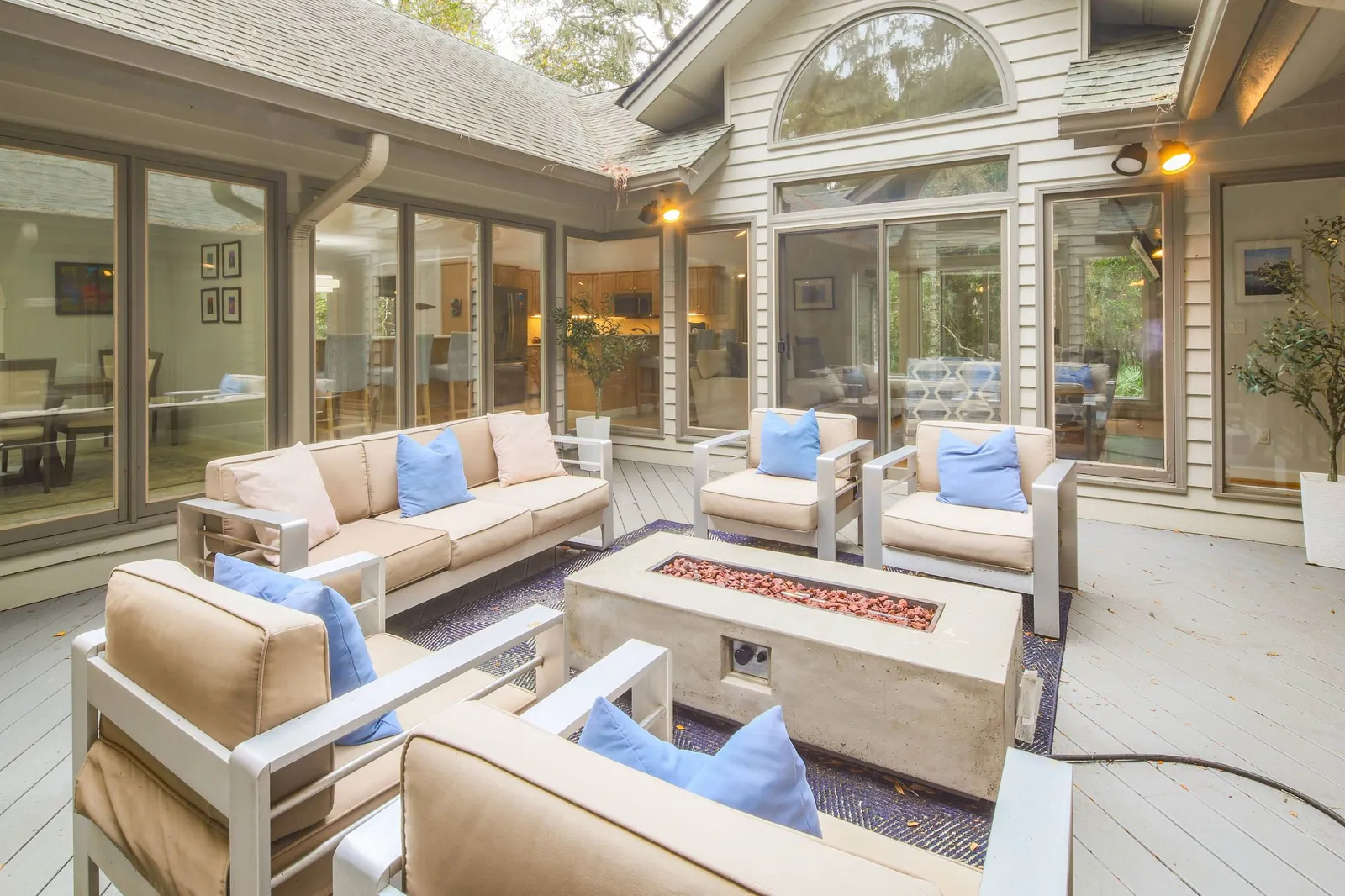 This wonderful home is built around this central atrium with a seating area and fire pit.
